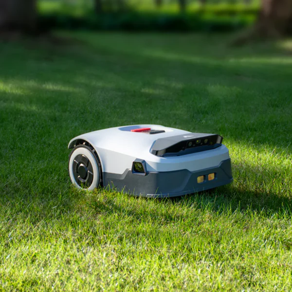 Genie AI Robot Mower on a vibrant green lawn, designed for automated scientific mowing and lawn care maintenance.